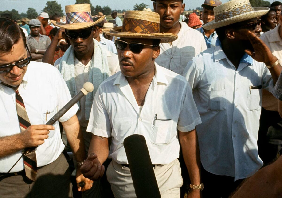 Dr Martin Luther King Jr speaks to reporters 